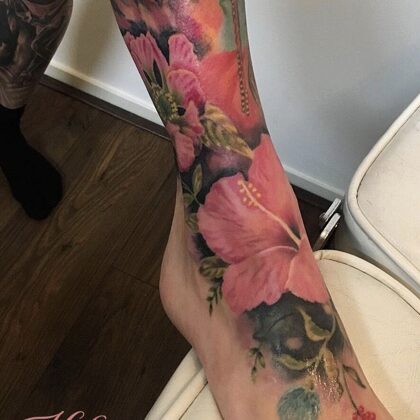 Foot tattoo ibiza flowers in color realistic
